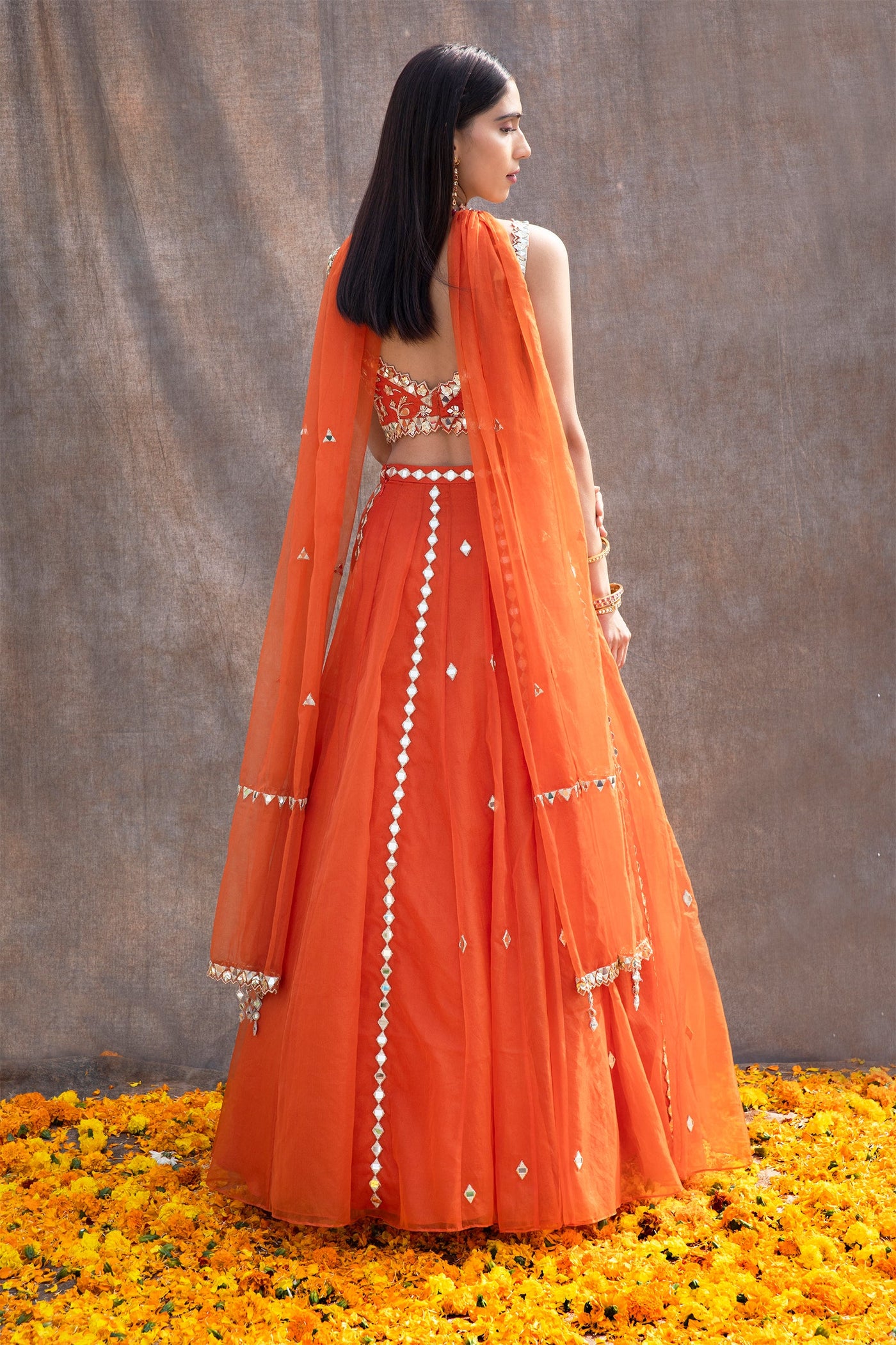 Riya Jain in Mirror Work V-Hem Bustier With High Waist Mirror Lines Lehenga And Embroidered Dupatta